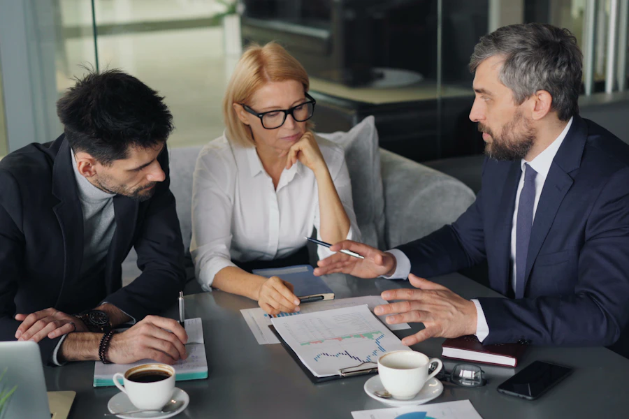 A team reviewing reports and figures together in a meeting